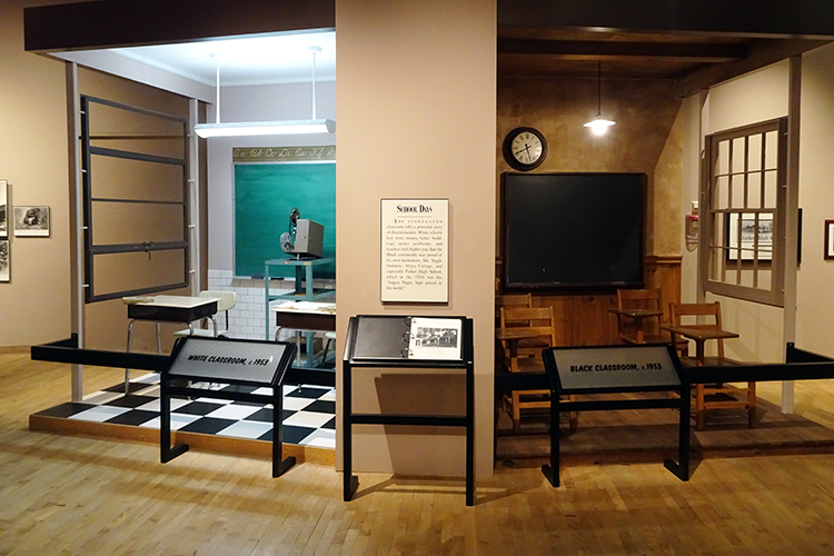 A reconstruction of two segregated classrooms in the South during Jim Crow displayed at the Birmingham Civil Rights Institute in Alabama