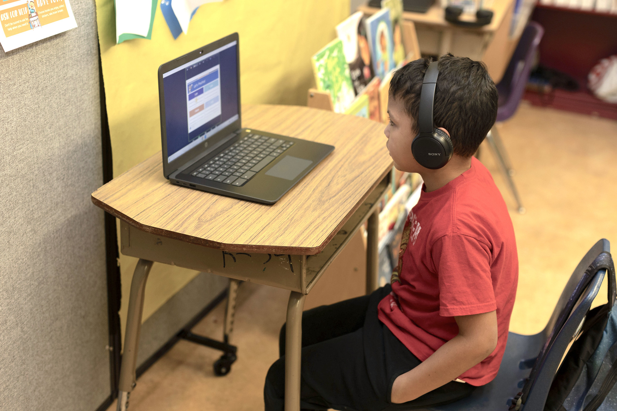 reading partners is ramping up innovation; a student sits at a computer learning through our online tutoring platform, Reading Partners Conencts