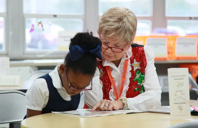 student-tutor pair working on a literacy lesson
