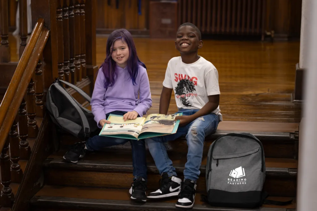 two students reading together
