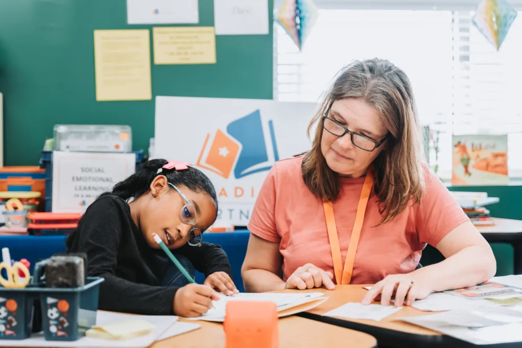 tutor and student working on boosting the student's literacy skills