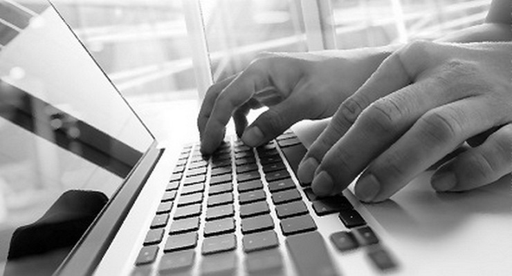 person typing on a laptop; americorps members stepped in