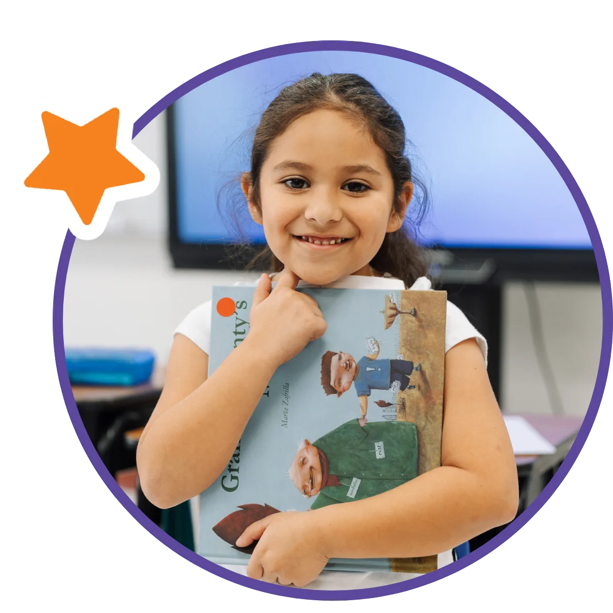 student smiling with book