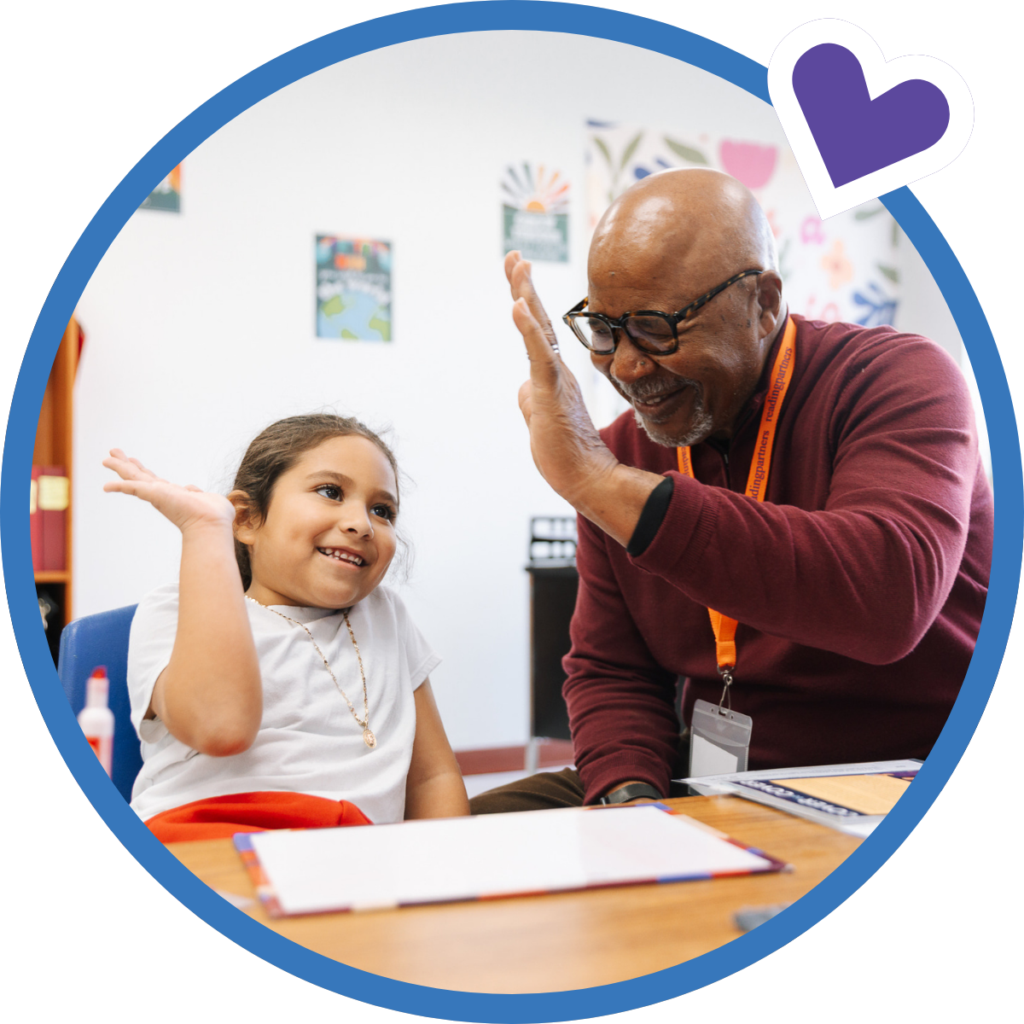 student and tutor high-fiving