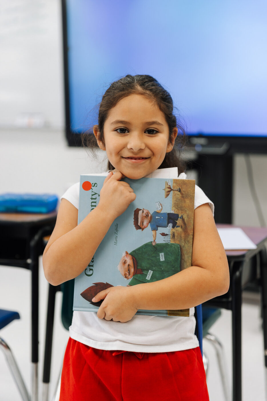student holding book
